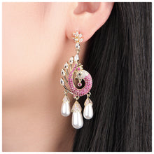Cargar imagen en el visor de la galería, UJOY Peacock Inspired Drop Earrings – Gold Plated with Pink Crystals &amp; Pearl Tassels